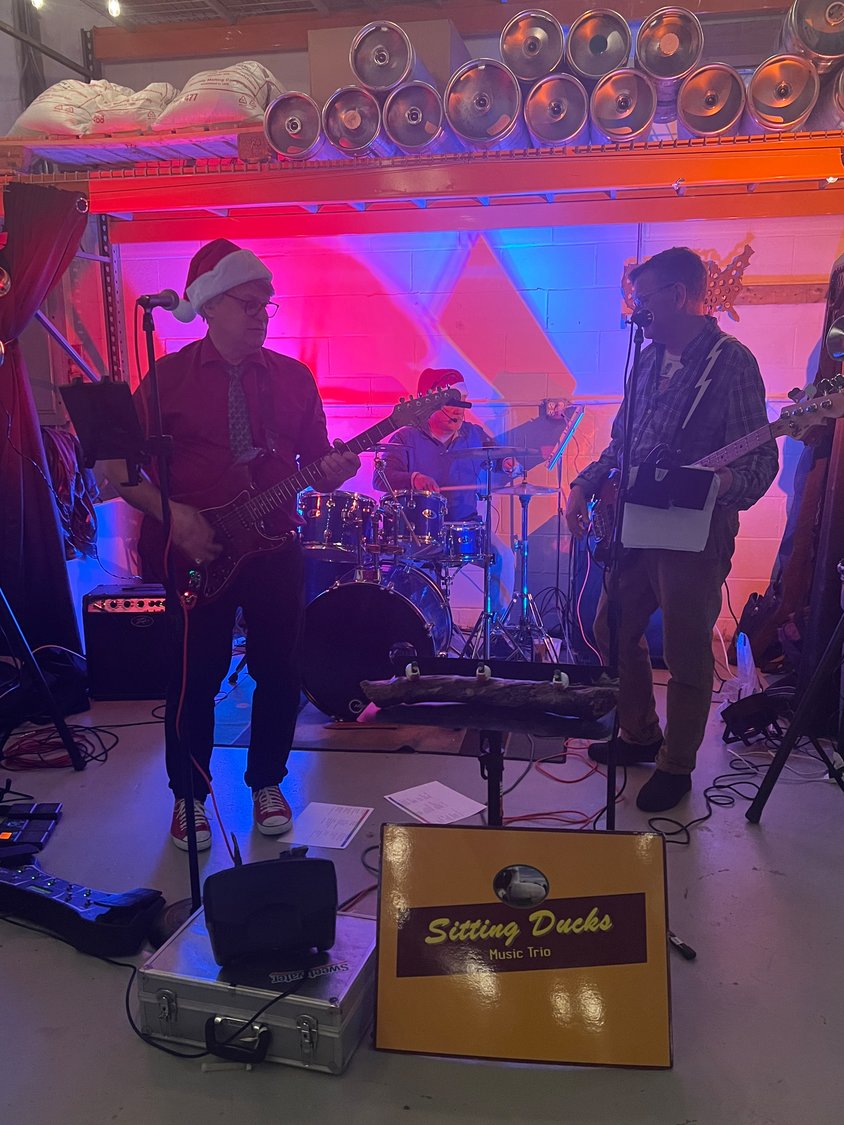 The musical trio Sitting Ducks donated their time to the Habitat for Humanity fundraiser at Freedom Brewing, bringing their eclectic mix of the best in the genres of classic rock, pop, Motown, country, honky-tonk, and more, along with their good vibes and uplifting energy.